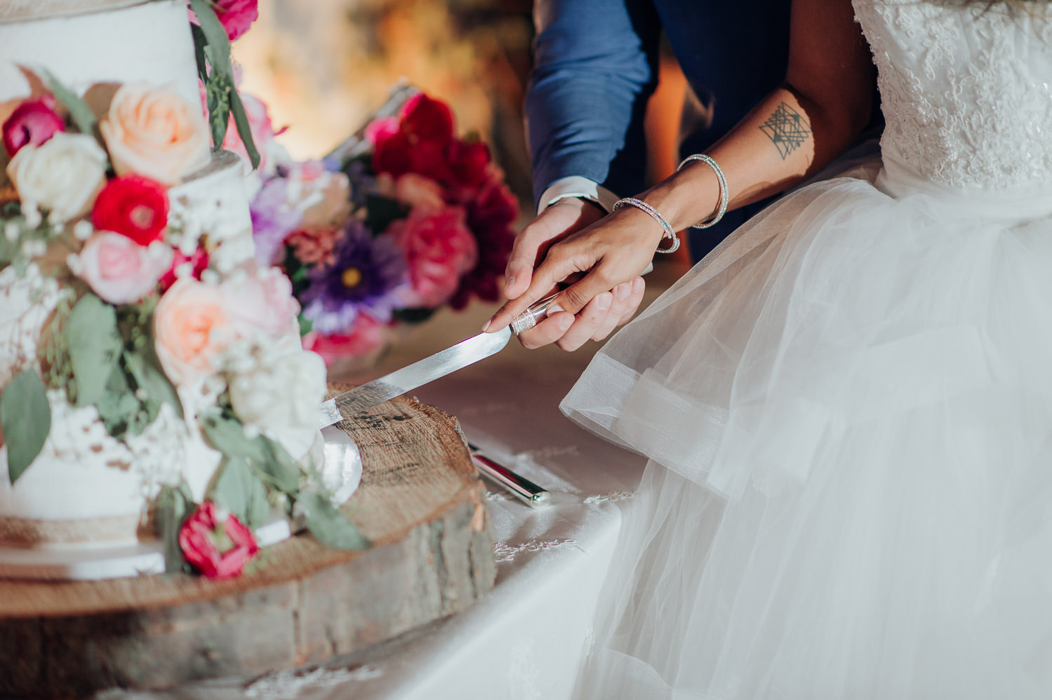 Cake cutting photo at a Toronto wedding featuring Sammycakes