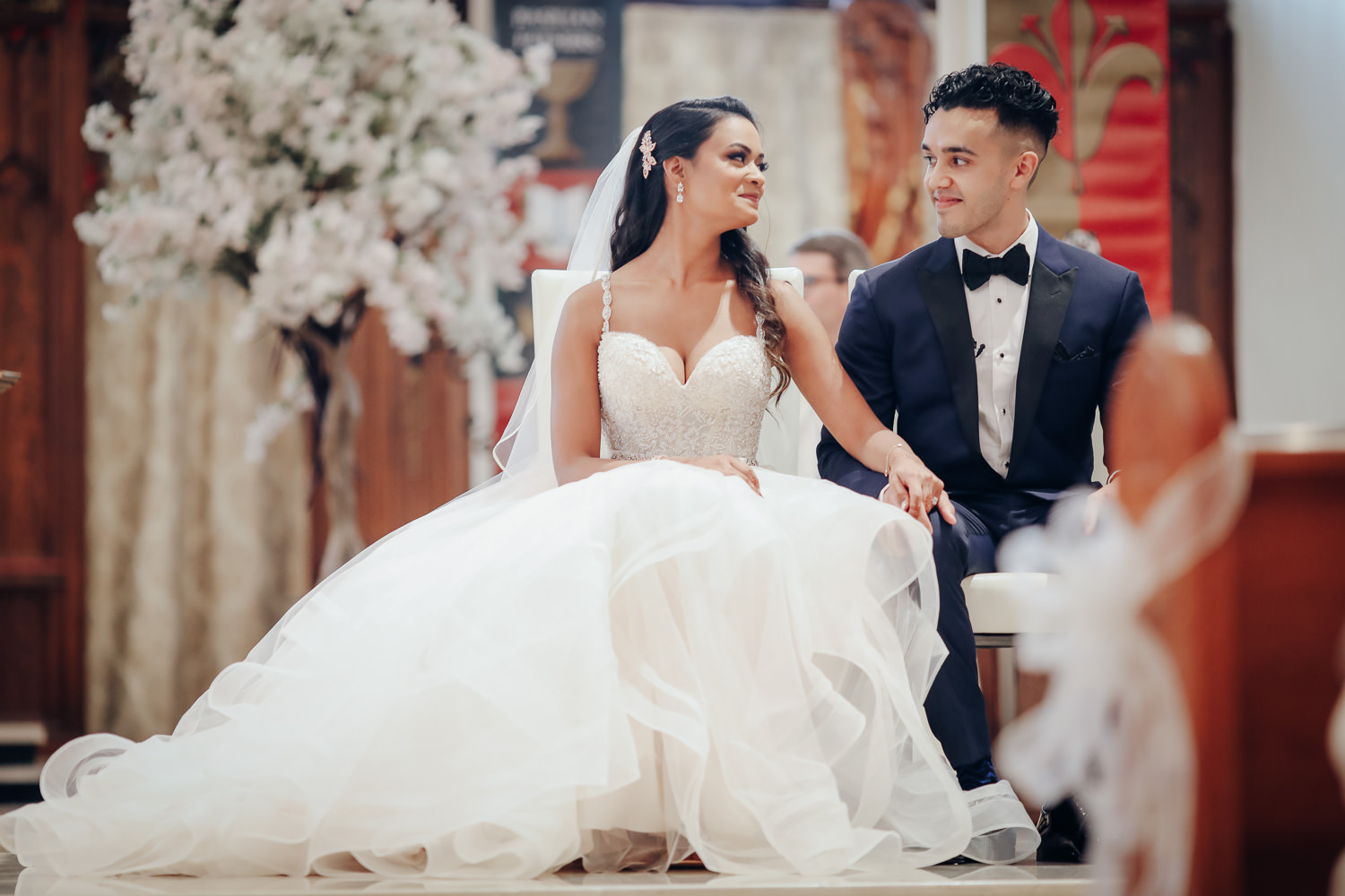 A sweet moment of bride and groom at the St. Basil Catholic Wedding