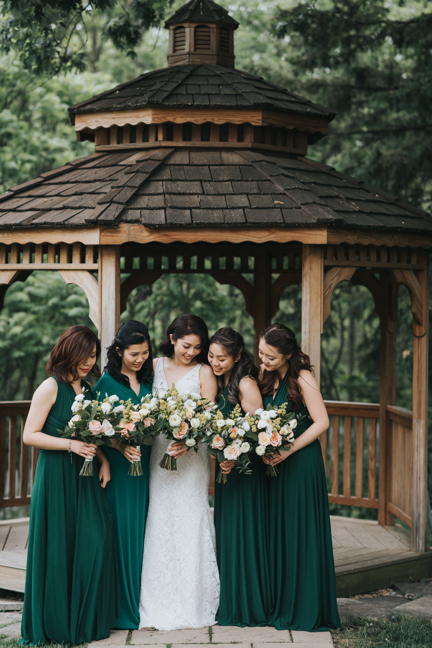 Doctor's House bride and bridesmaids at wooden gazebo photos