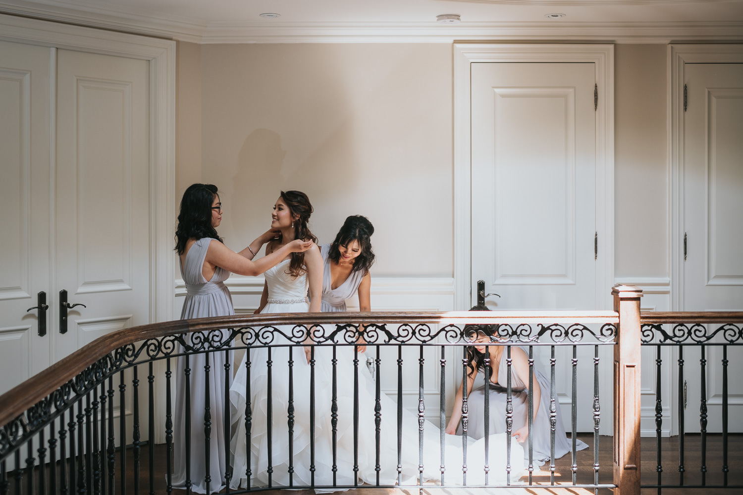 Toronto wedding photography bride getting into dress