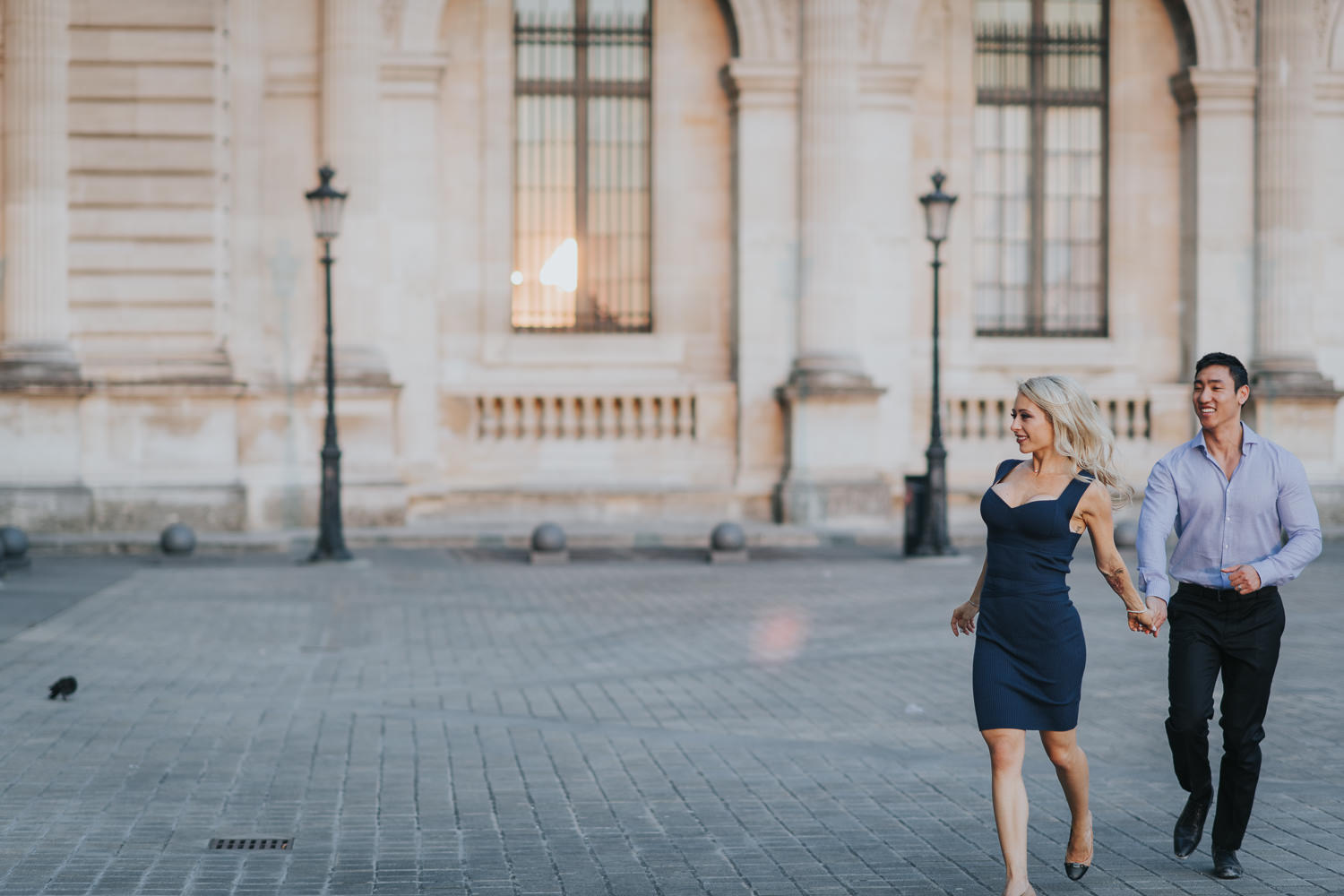 romantic Paris engagement couple running