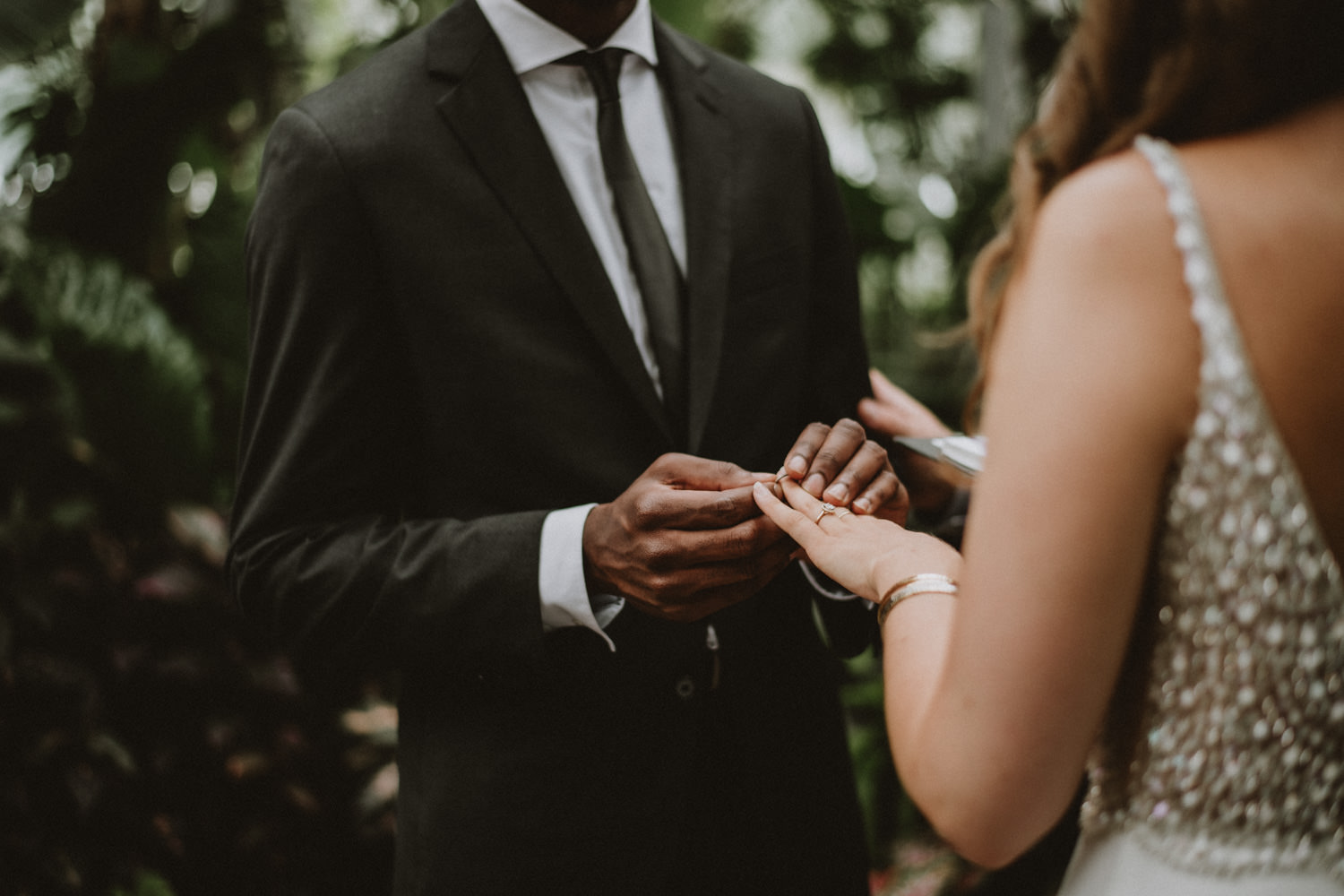 Intimate wedding at Allan Gardens Toronto, ring exchange photography