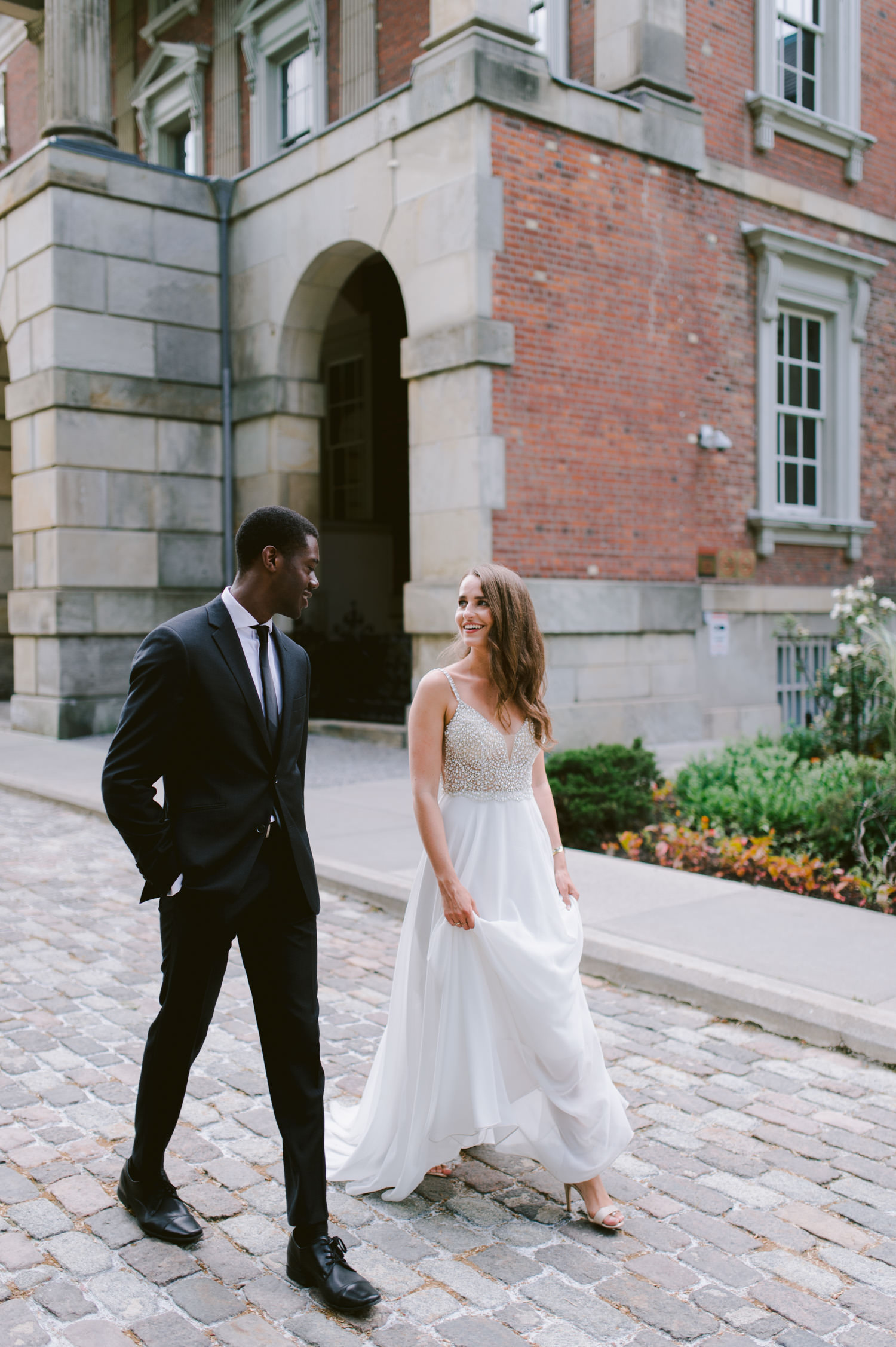 Editorial luxurious wedding photography at Osgoode Hall Toronto couple walking
