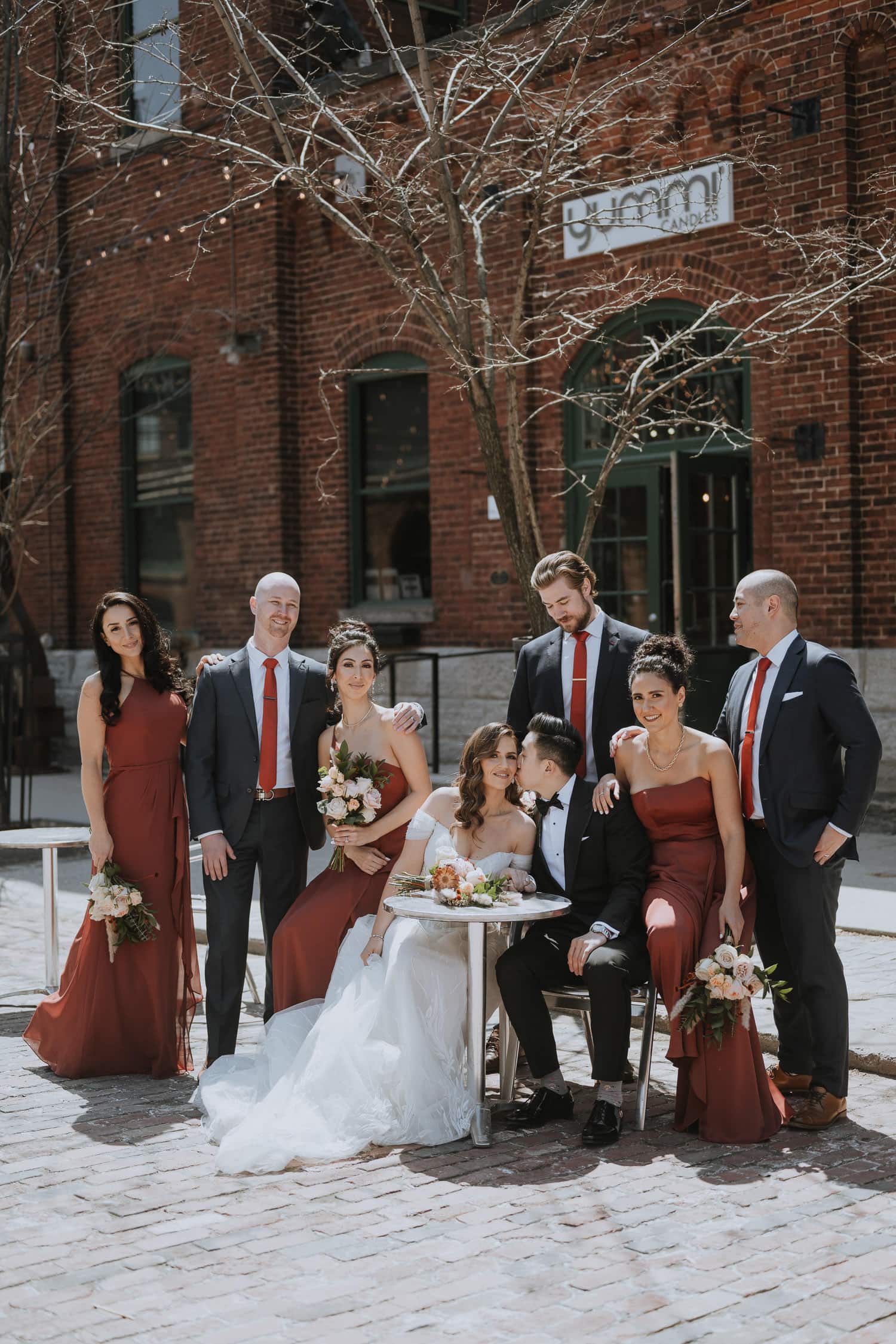 A wedding party photo at the Toronto Distillery District