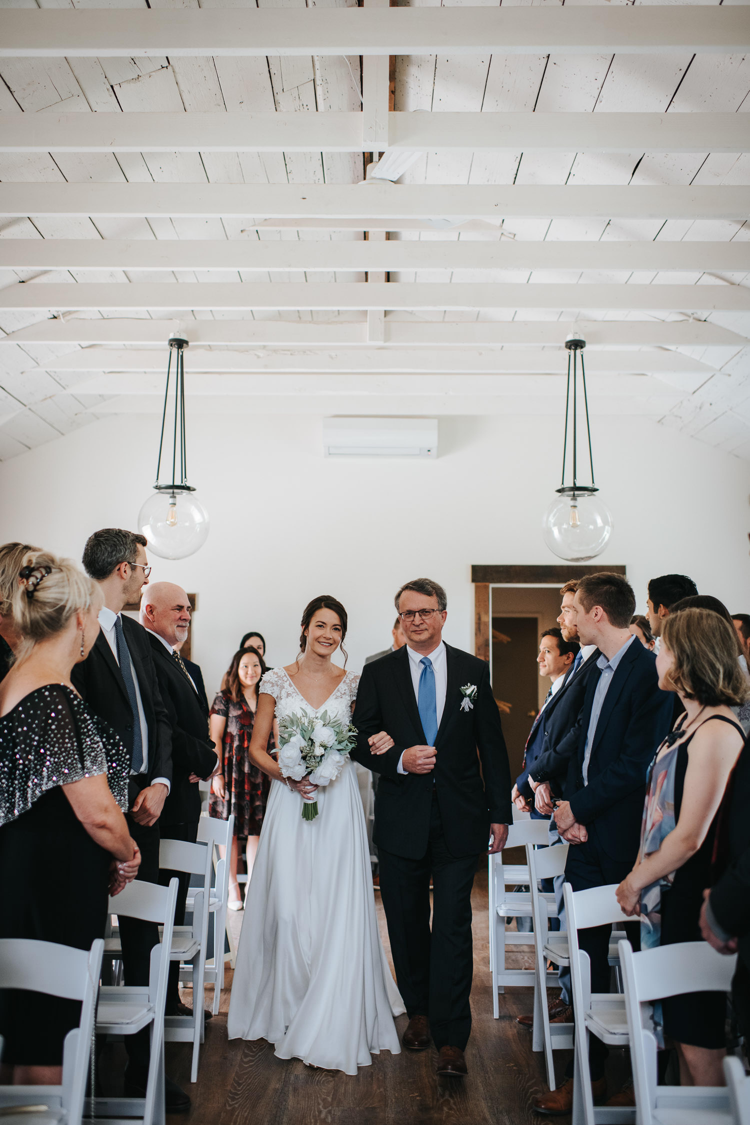Cave Spring Vineyard Wedding Ceremony Bride walking down the isle