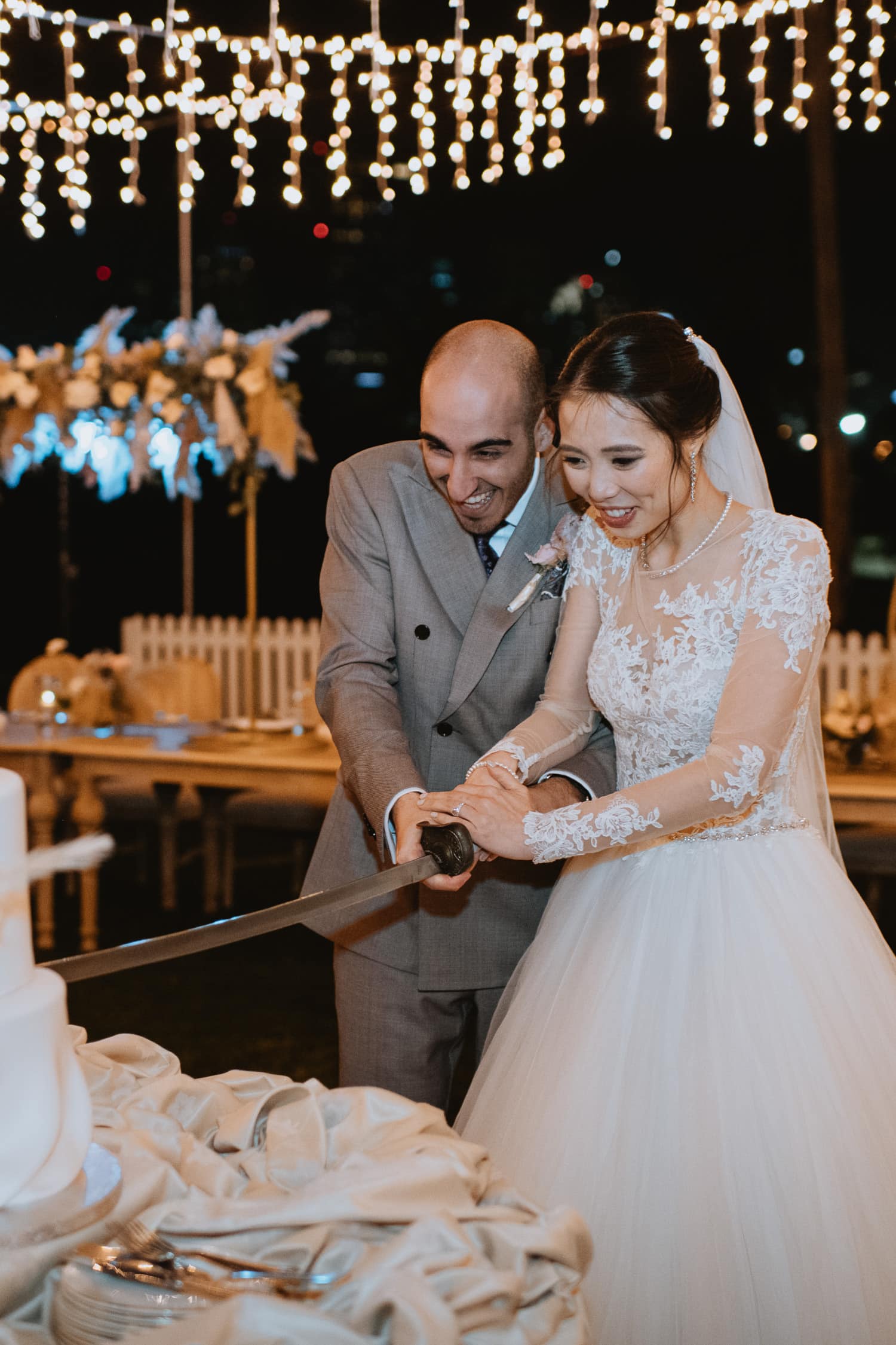 Outdoor Evening Wedding Reception Cake Cutting