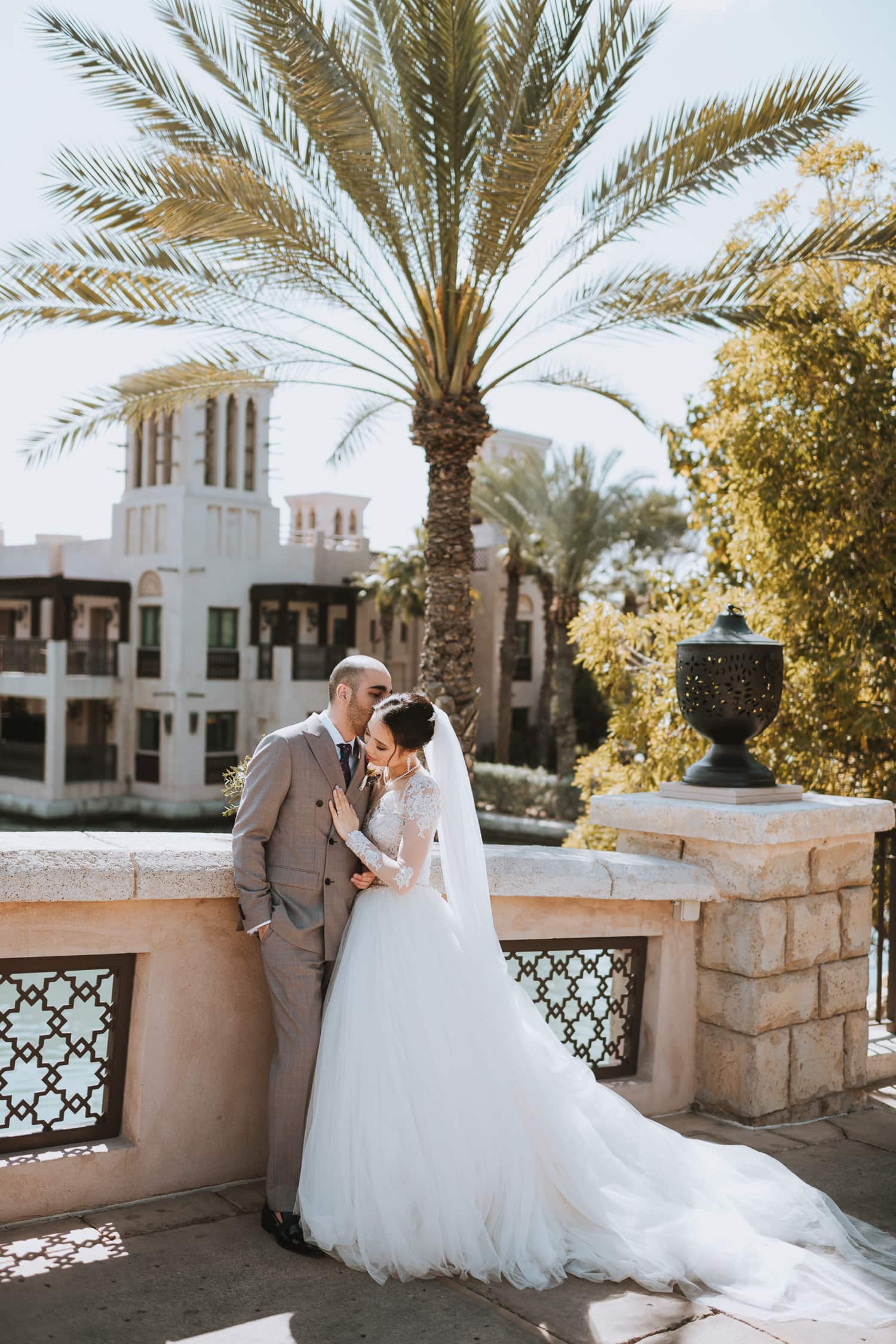 Whimsical Dubai Wedding Photo on the bridge in the Jumeirah Al Qasr resort