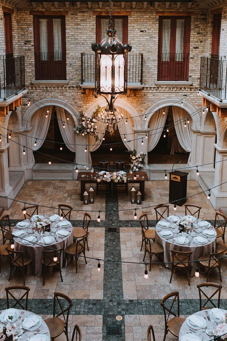 View of Hacienda Sarria Courtyard wedding reception decor from the balcony