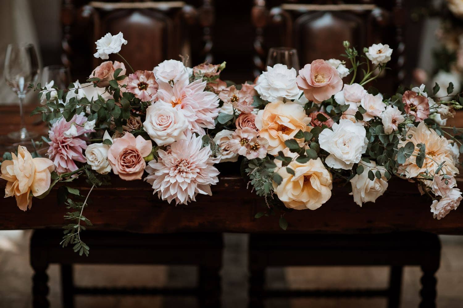 Boho head table flower setup at Hacienda Sarria wedding