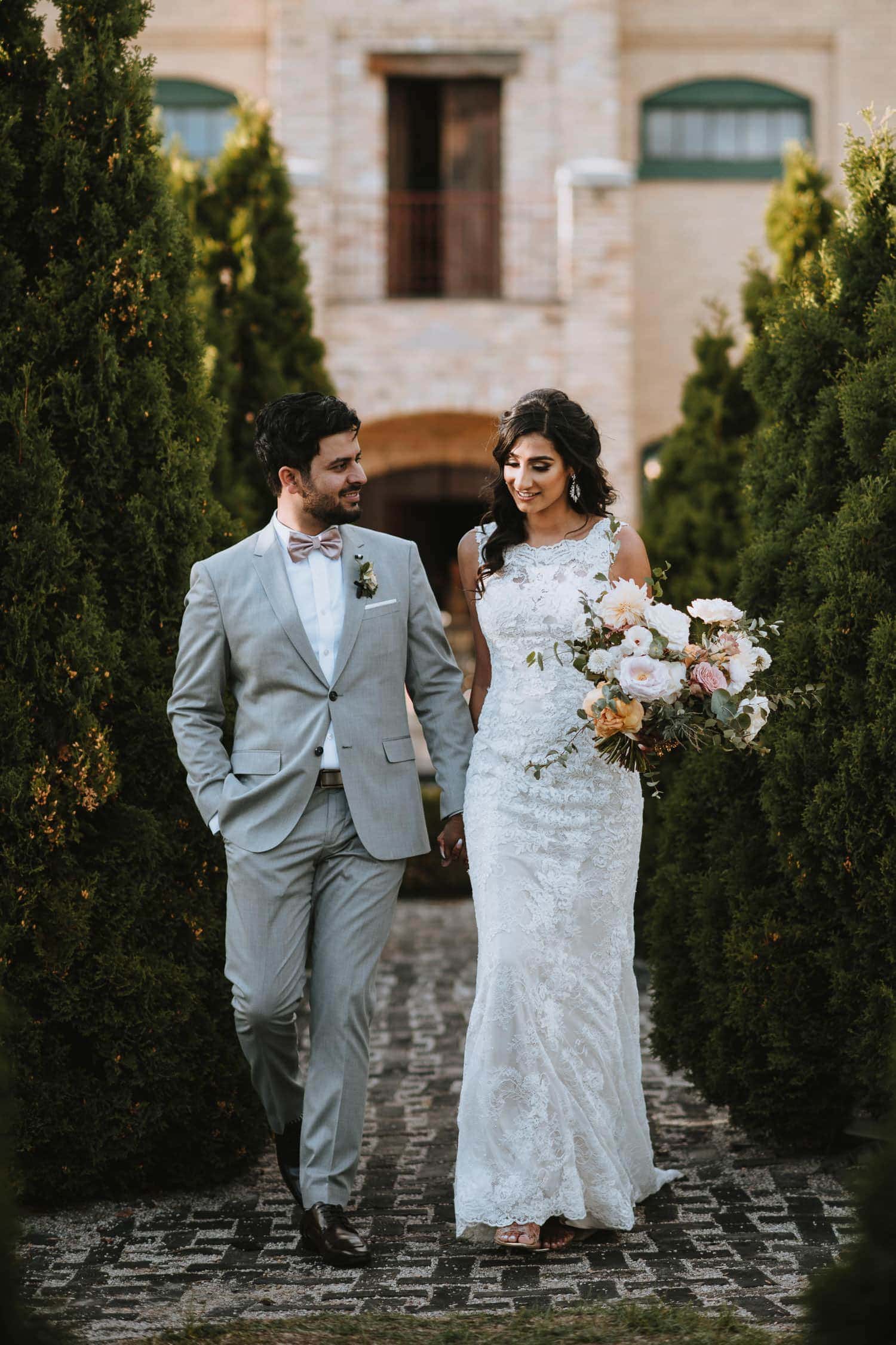 Bride and groom candid portrait at a Spanish style estate in Kitchener, Ontario