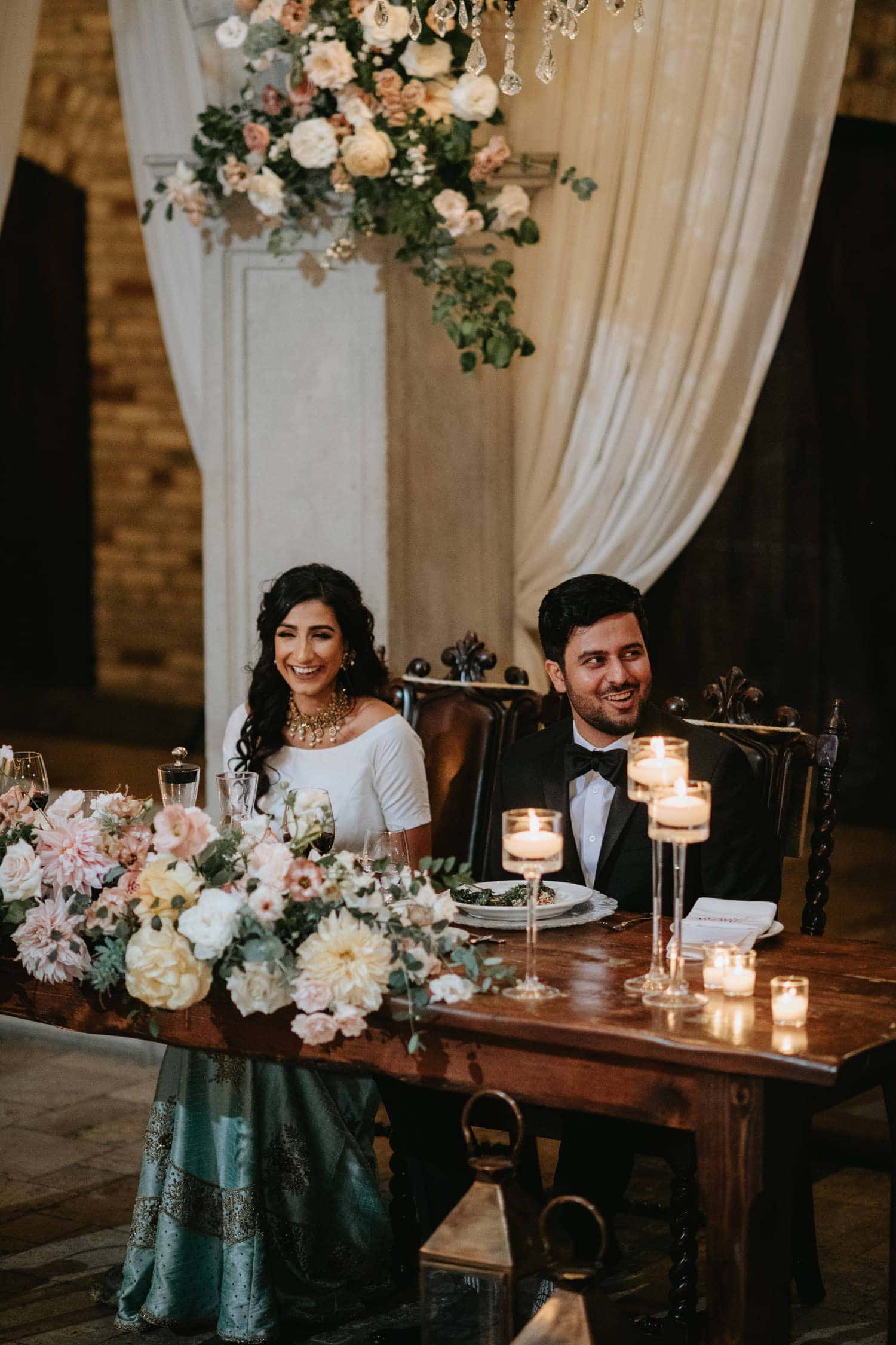 Bride and groom's reaction to maid of honor's speech during the wedding reception in Hacienda Sarria