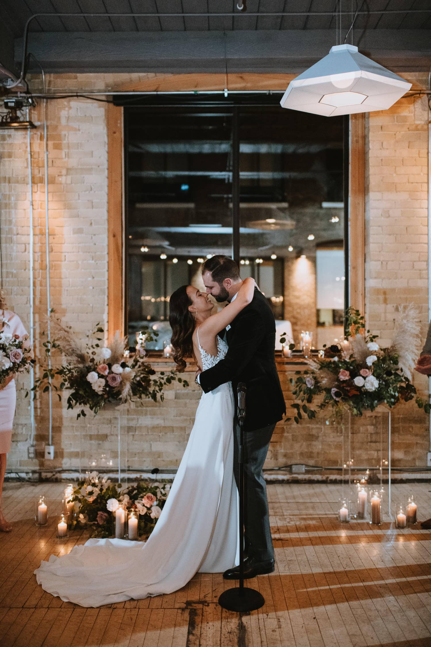 First kiss at an industrial chic wedding in Toronto