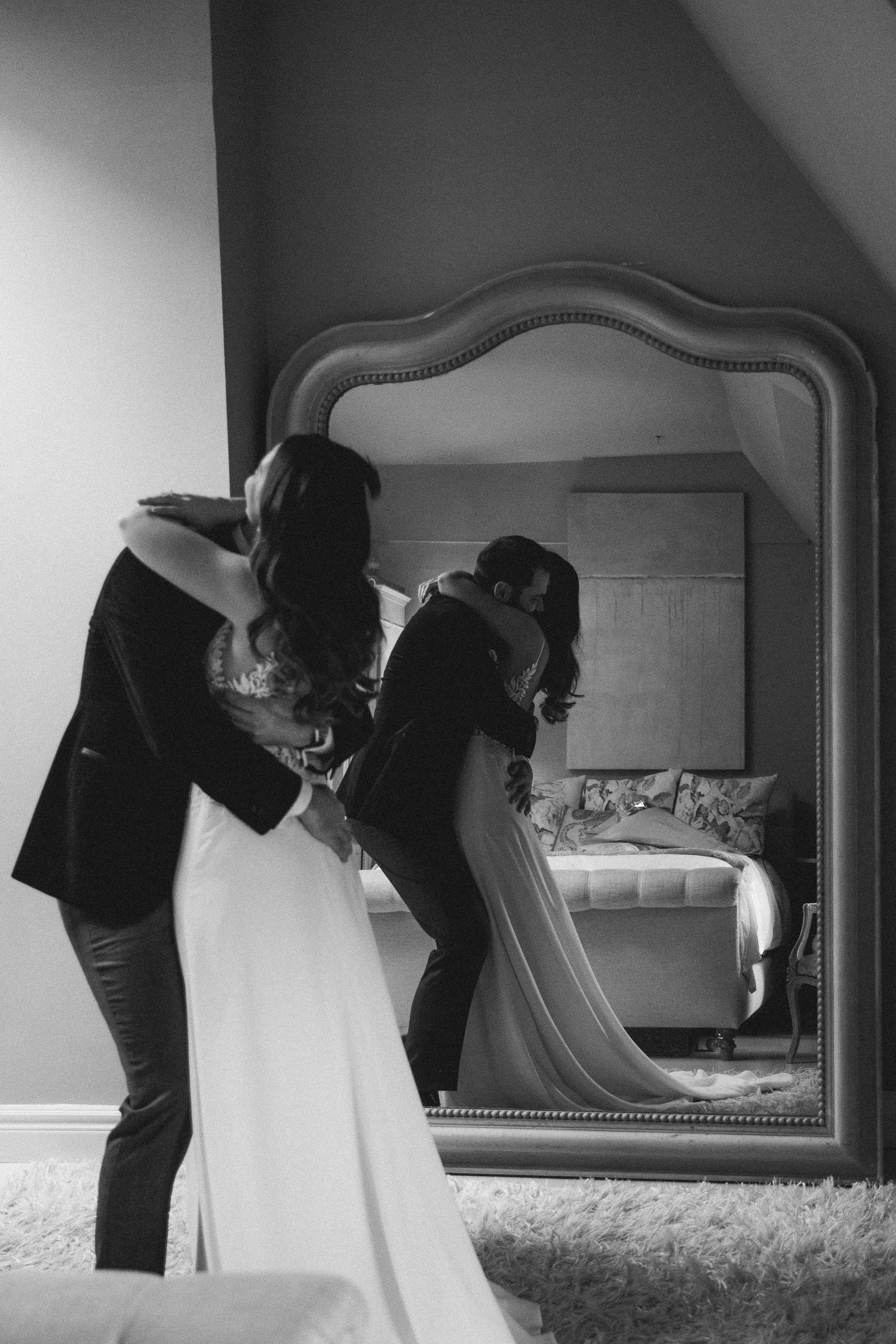 First look photo on wedding day at the bridal suite