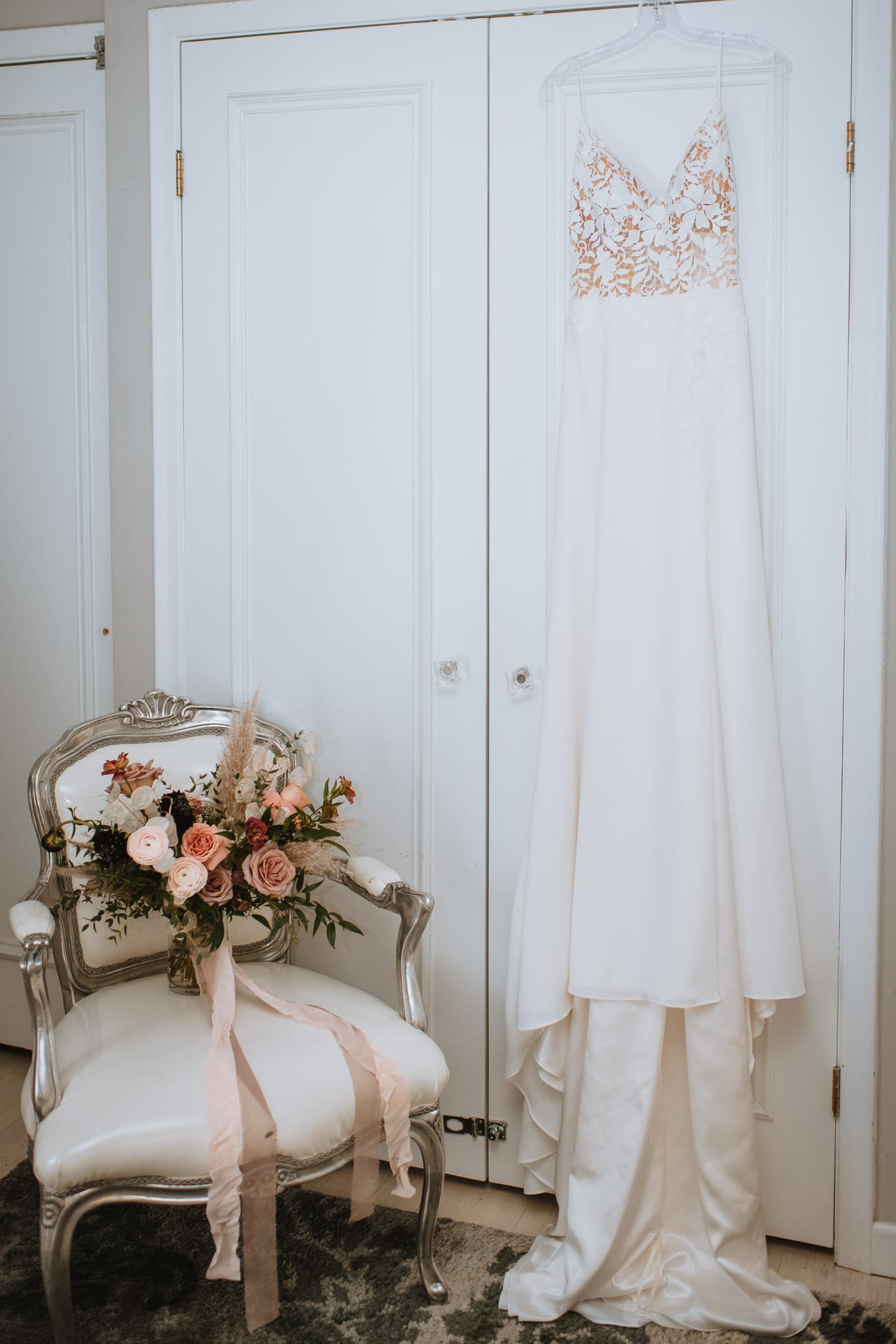 Wedding dress and bouquet detail in the bridal suite