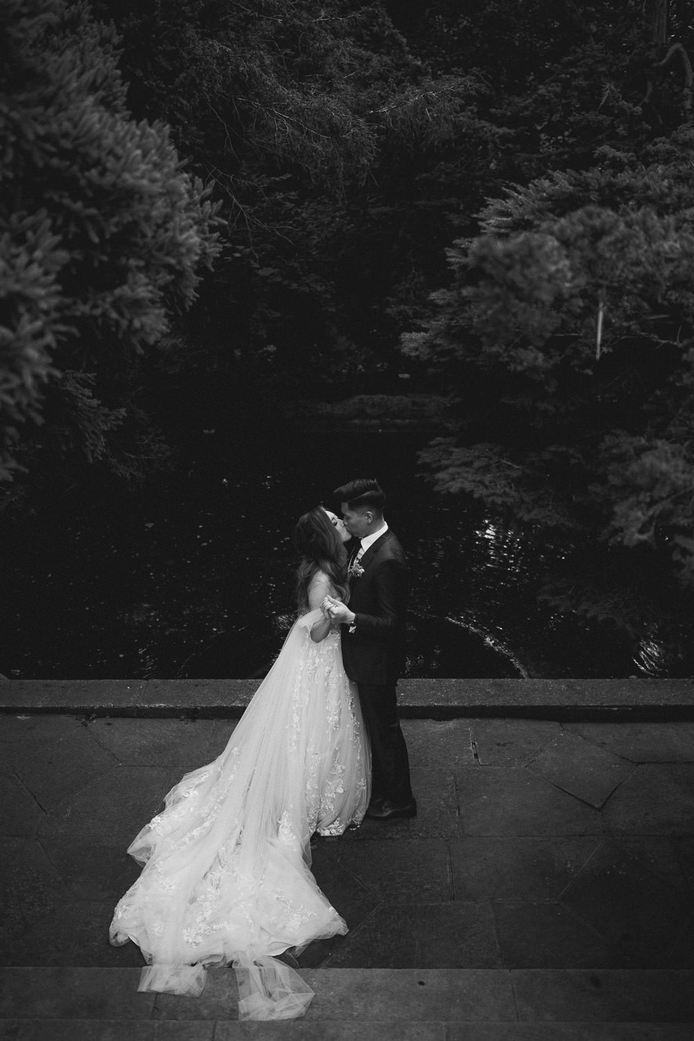 Graydon Hall Manor Wedding photo of a newly wed couple dancing by the pond