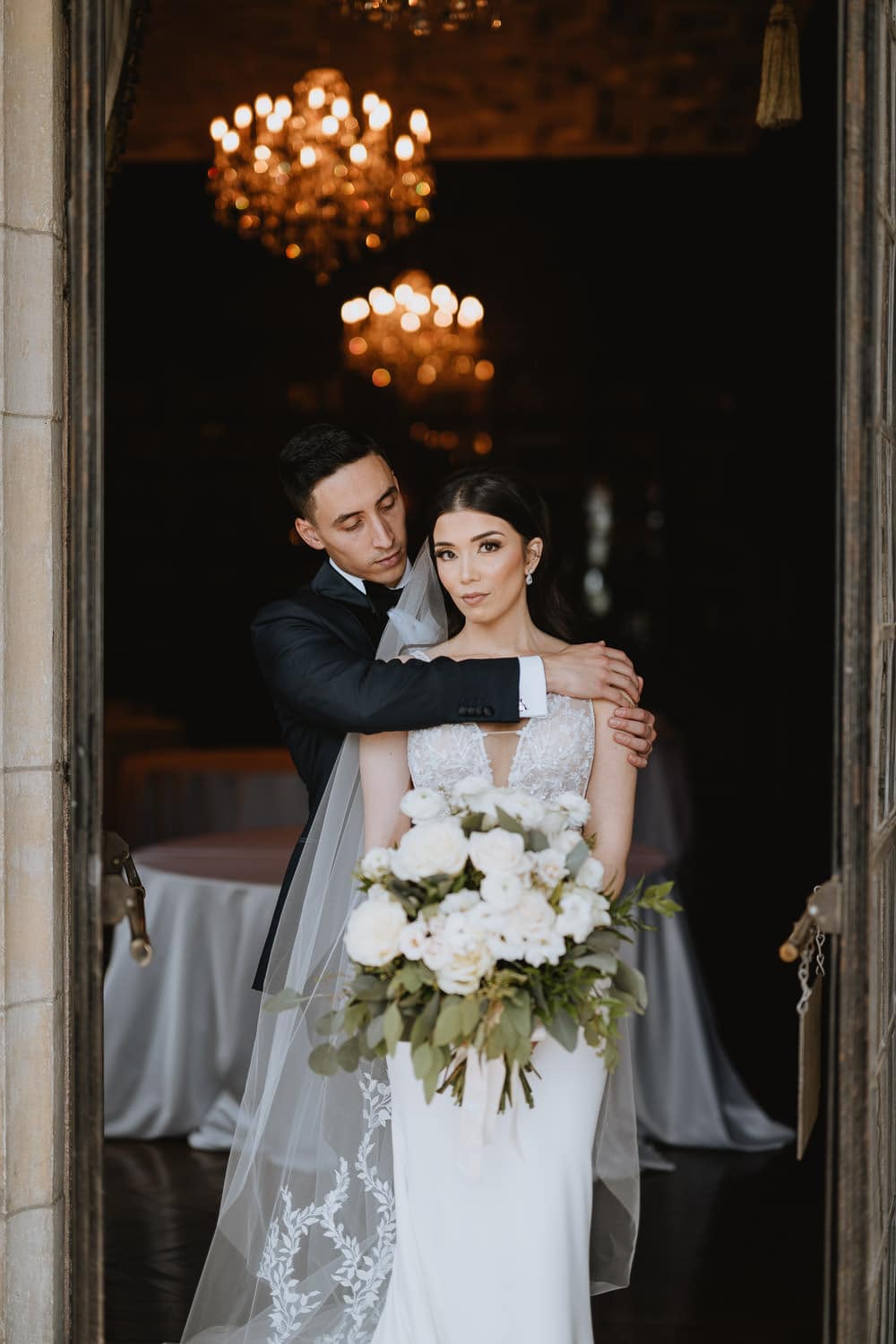 Casa Loma Wedding Portrait of bride and groom in front of the library