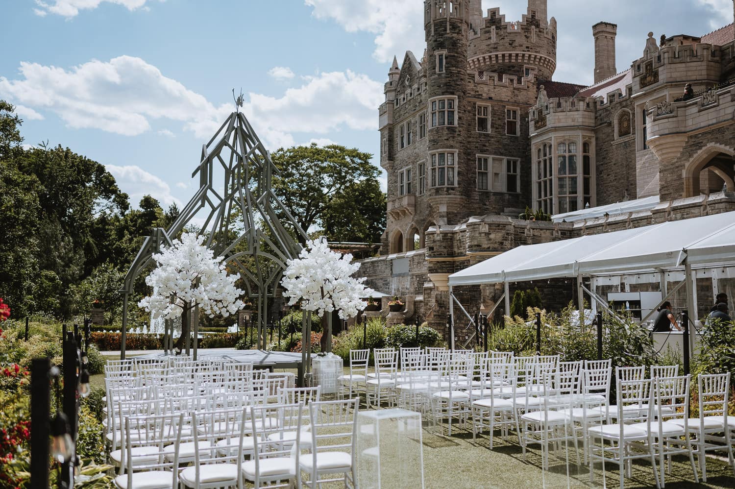 Casa Loma Garden and Terrace wedding ceremony decor with white cherry blossoms surrounding the altar