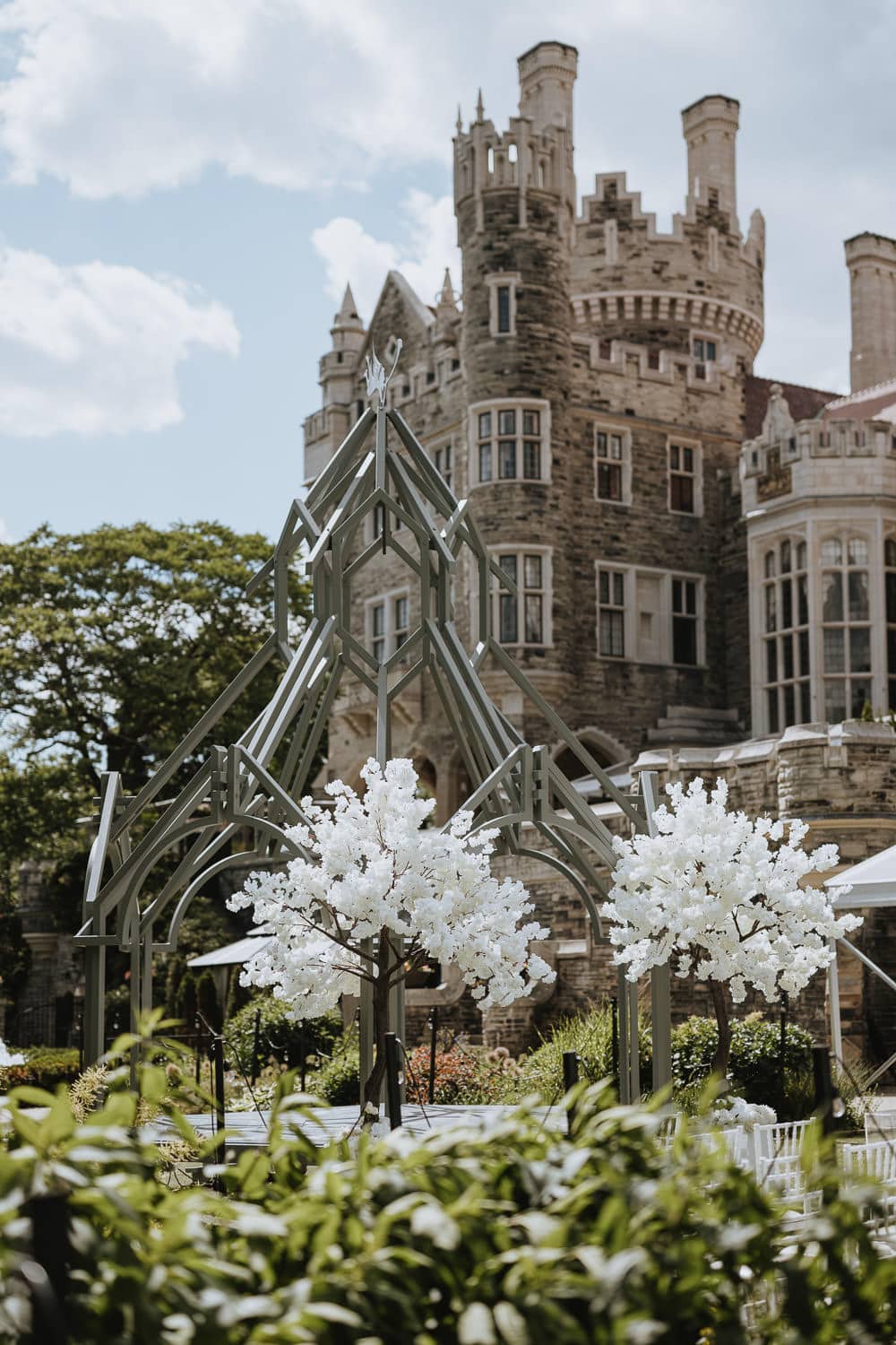 Casa Loma Terrace Outdoor wedding ceremony set up with the castle in the backdrop