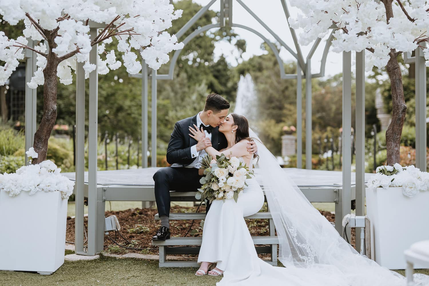 Portrait of bride and groom at the Casa Loma Garden